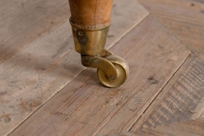 close up of pine table leg wheels